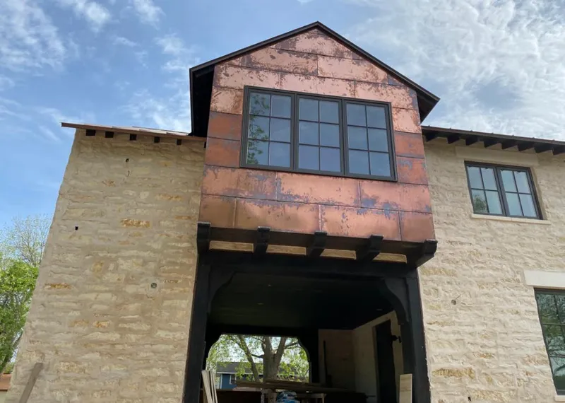 Copper metal panel facade on a stone building for Skylight Installation in Calabasas