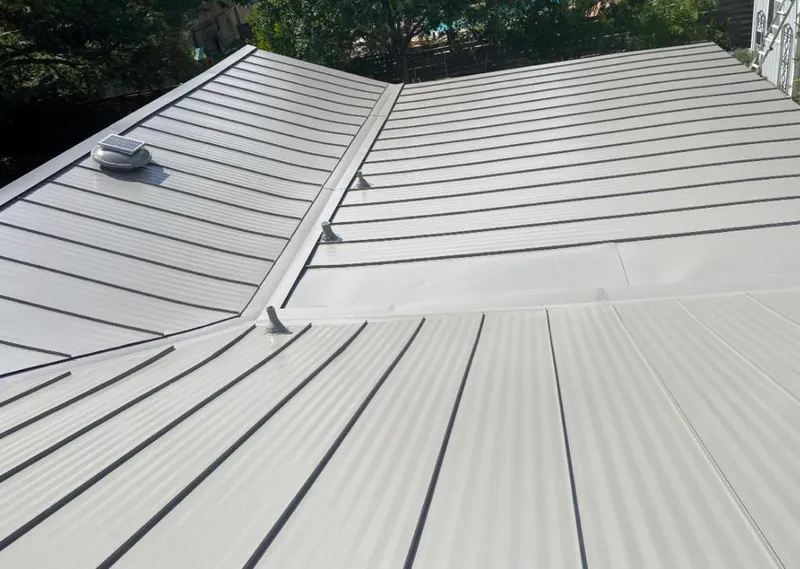 Solar attic fan installed on a metal roof for Roof Ventilation in Calabasas